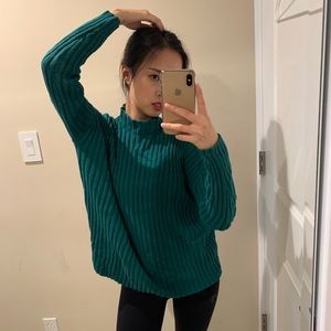 Green turtleneck sweater with open back